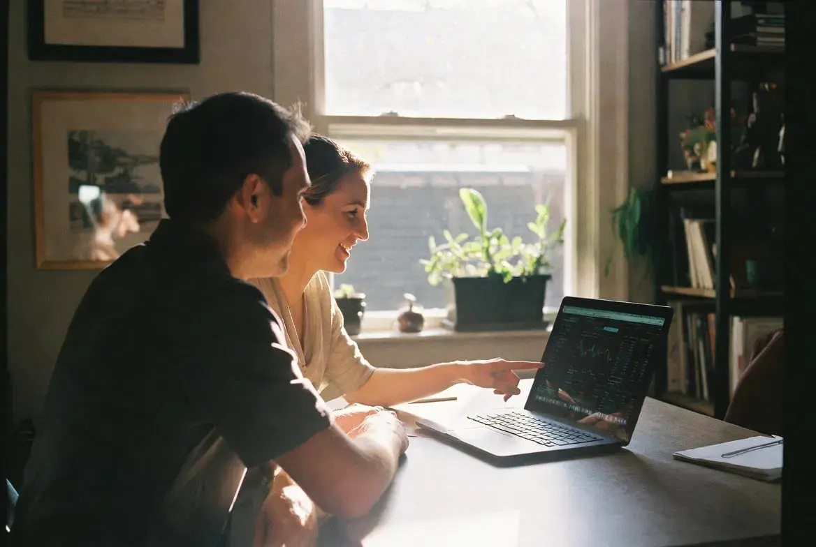 A coach and client collaborating during a session